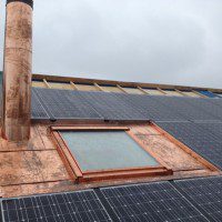 Insertion d'un Velux et d'une cheminée dans la surface de panneaux