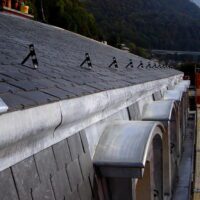 Mansard en zinc naturel avec lucarnes arrondies