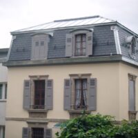 Maison en mansards, avec ardoise naturel et placage en zinc